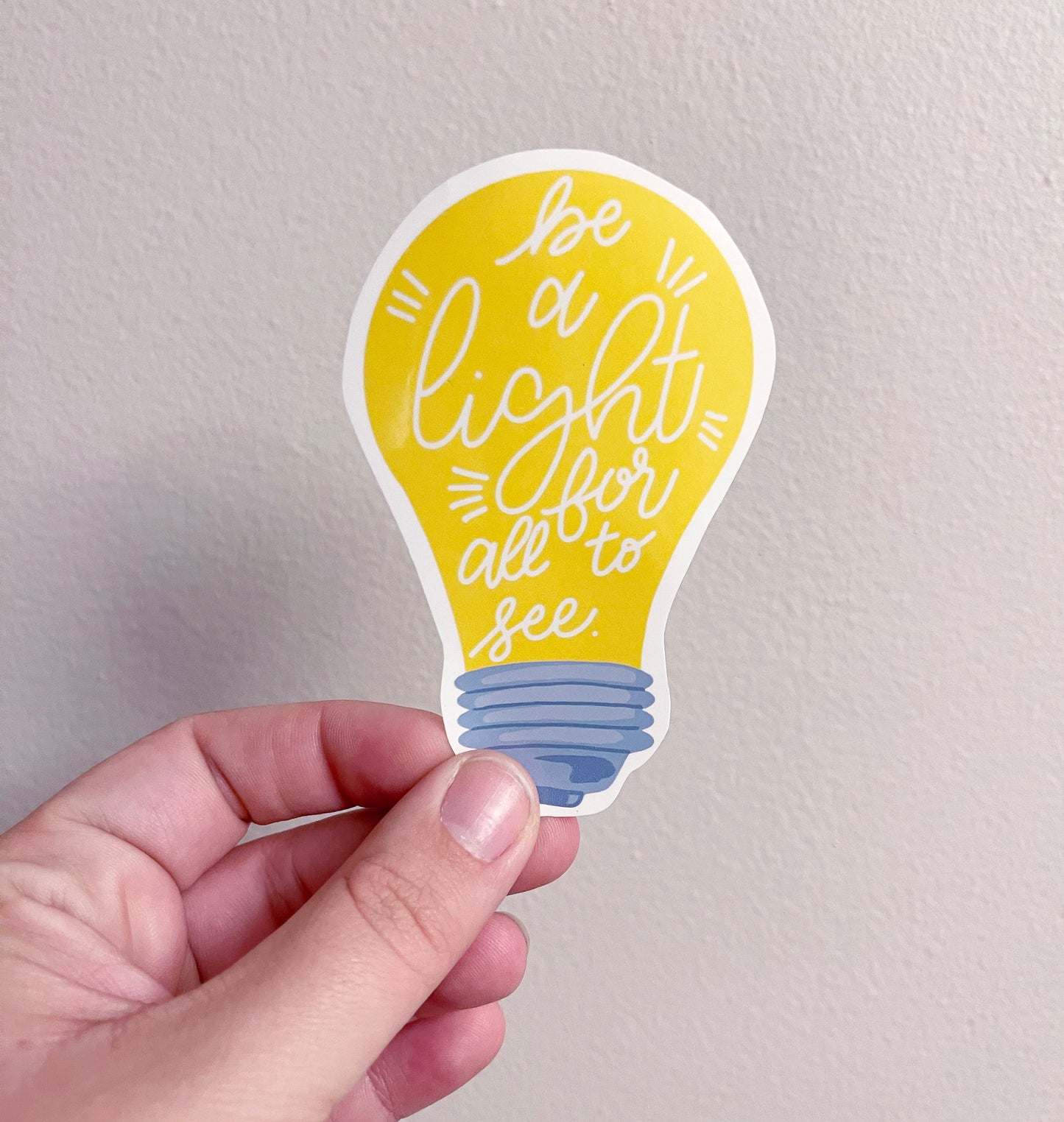 lightbulb sticker with the vers be a light for all to see 